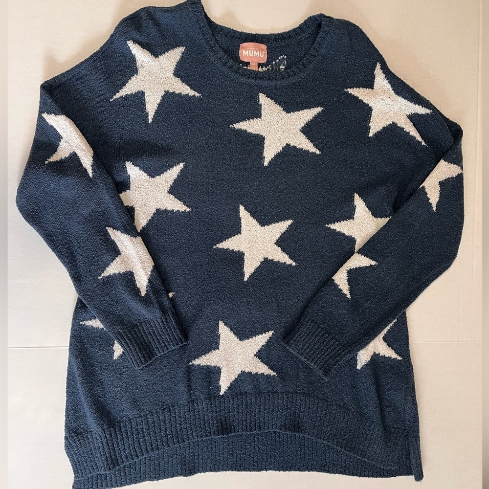 Oversized Show Me Your Mumu sweater with stars.